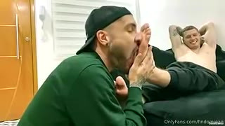 Latino boy licking masters feet